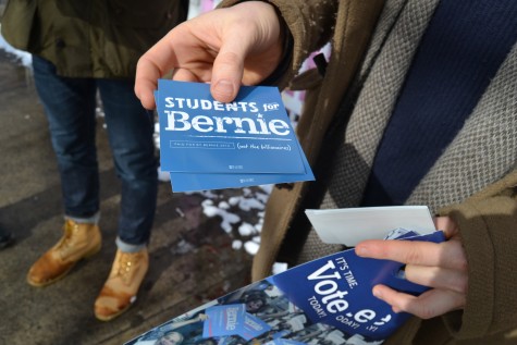 Volunteers hand out Bernie Sanders stickers at the primary in Keene, New Hampshire on Feb. 9, 2016.