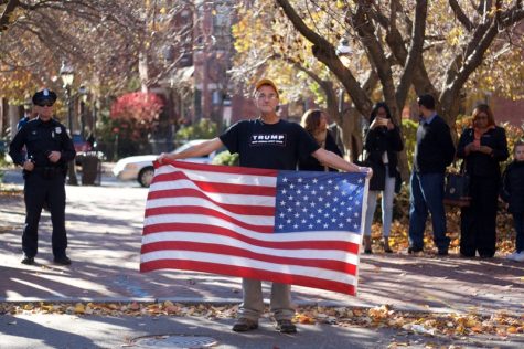 John Milberg Jr., 61, stands opposite the anti-Trump marchers in Springfield. (Morgan Hughes/Amherst Wire)