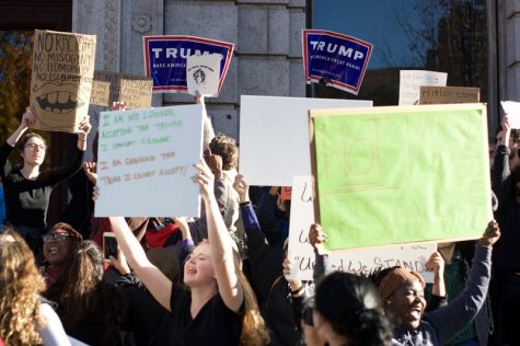 Anti-Trump protesters attempt to block the presence of Trump supporters across from a stop on their march through downtown Springfield. (Morgan Hughes/Amherst Wire)