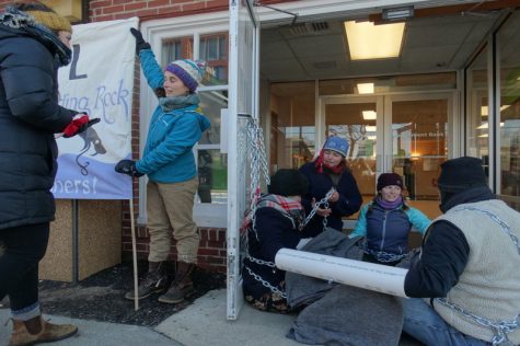 VIDEO: Protesters chained to TD Bank doors risk arrest