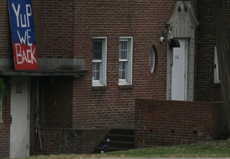 A sign saying "Yup We Back" sits outside of Theta Chi just one day after UMass lifted their 5-week suspension. (Brian Choquet/Amherst Wire) 