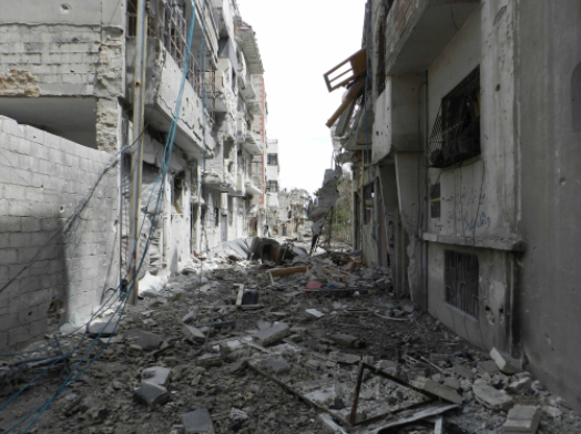 Destruction in Homs, Syria (Bo Yaser/ Wikimedia Commons).