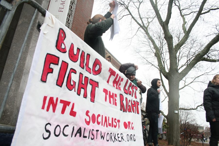 The International Socialist Organization hosted a rally against the proposed GOP Federal Tax Plan outside the University of Massachusetts Amherst Student Union, Dec. 5. (Brian Choquet/ Amherst Wire)