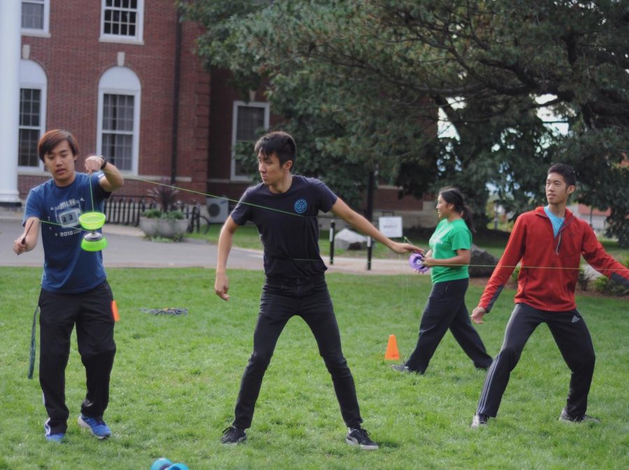 Hubert Lin, Phil Francisco, and Michael Lai practice the Chinese yo-yo (left to right).