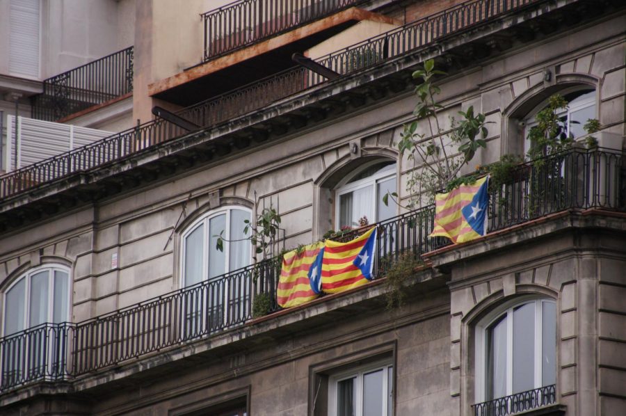 Catalonian flags hang on a balcony