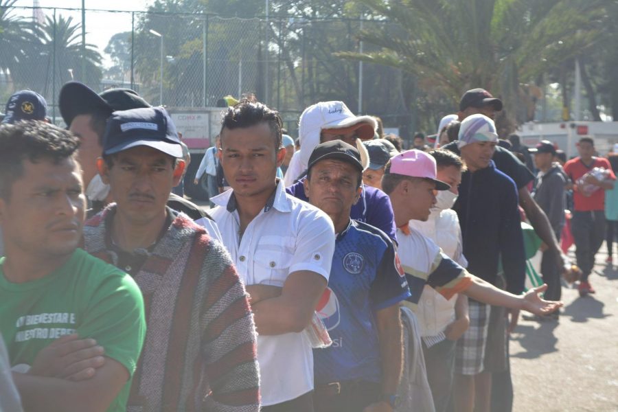 Line of migrants from Honduras, El Salvador and Guatemala waiting for breakfast.
(Creative Commons)