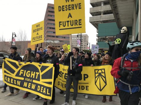 Students march in Springfield, MA to demand that Representative Richard Neal signs both the Green New Deal and the No Fossil Fuel Money Pledge