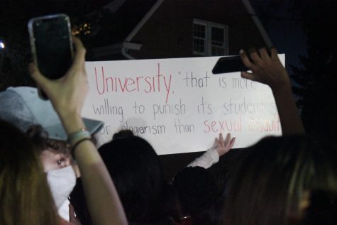 A sign that reads, A university that is more willing to punish students for plagiarism than sexual assault, at Sunday Nights protest.
