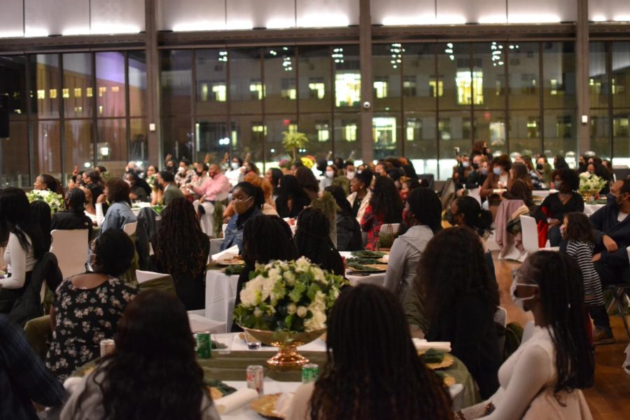 Poetry Jam guests attentively watching a performer by Tristan Smith