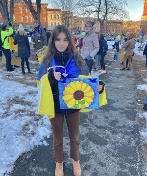Forrest at the protest holding a sign she made of a sunflower, the flower of Ukraine. Photo courtesy of Presley Forrest.