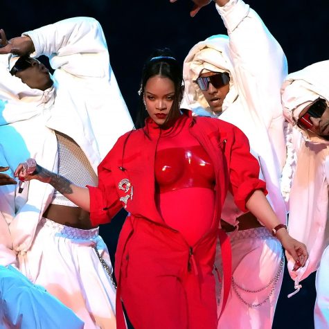 Rihanna dressed in red in a sea of white puffy outfits (The New Yorker)