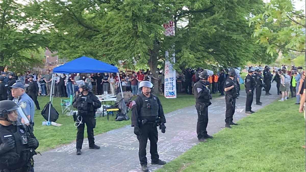 State police officers encircle protestors on May 7, 2024.