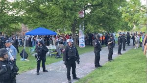 State police officers encircle protestors on May 7, 2024.