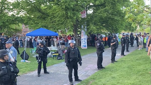 State police officers encircle protestors on May 7, 2024.