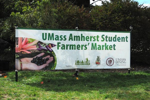 A banner at the front of Goodell Lawn welcomes students to the UMass Student Farmer's Market.